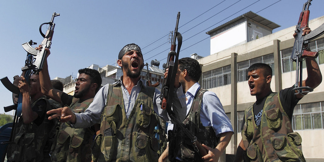 Free Syrian Army members shout Islamic slogans as they prepare to move into Aleppo's district of Salah Edinne